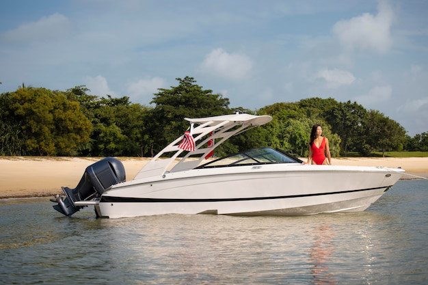 A person in a red swimsuit on a white boat