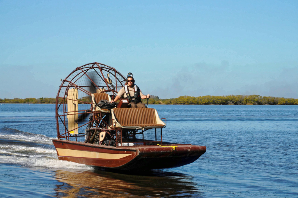 A person driving an airboat