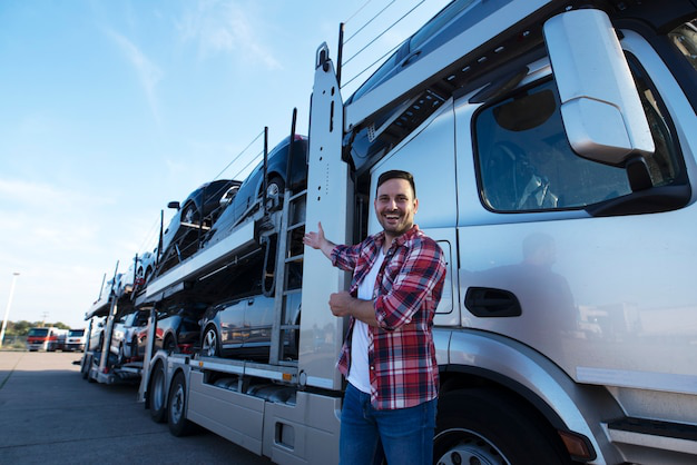 A sleet manager standing before a truck