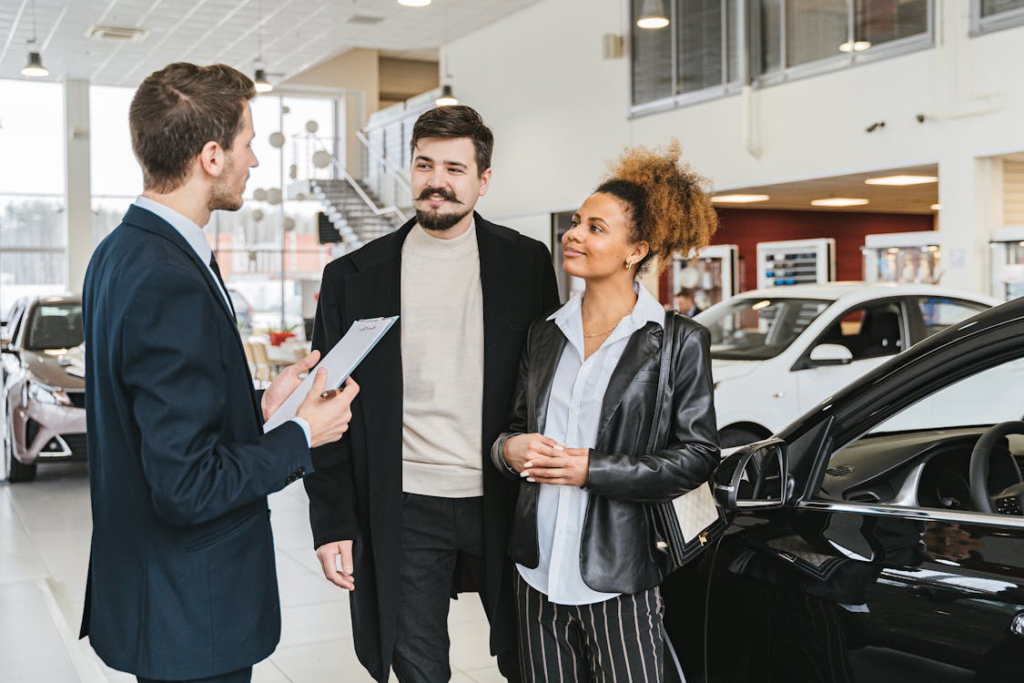 A couple discussing a title transfer with an auto tag agent in Florida