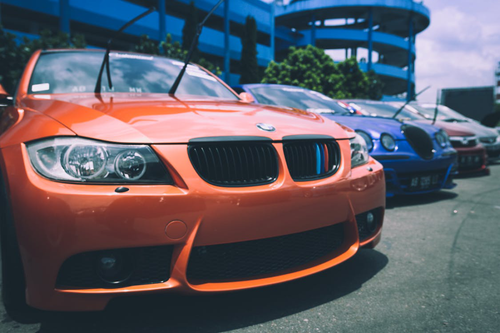 Cars in different colors parked in a row