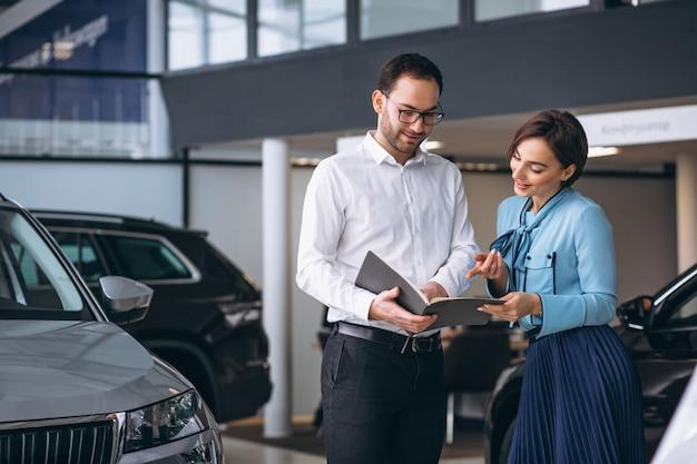 A vehicle titling expert guiding a client on the process