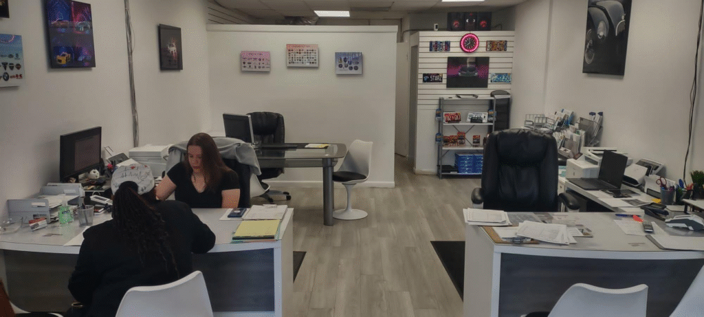 An auto tag agency professional with a client