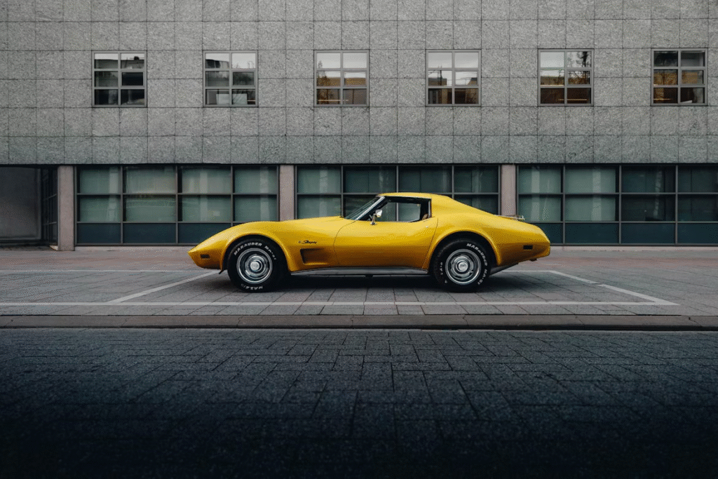 A yellow car parked in front of a building