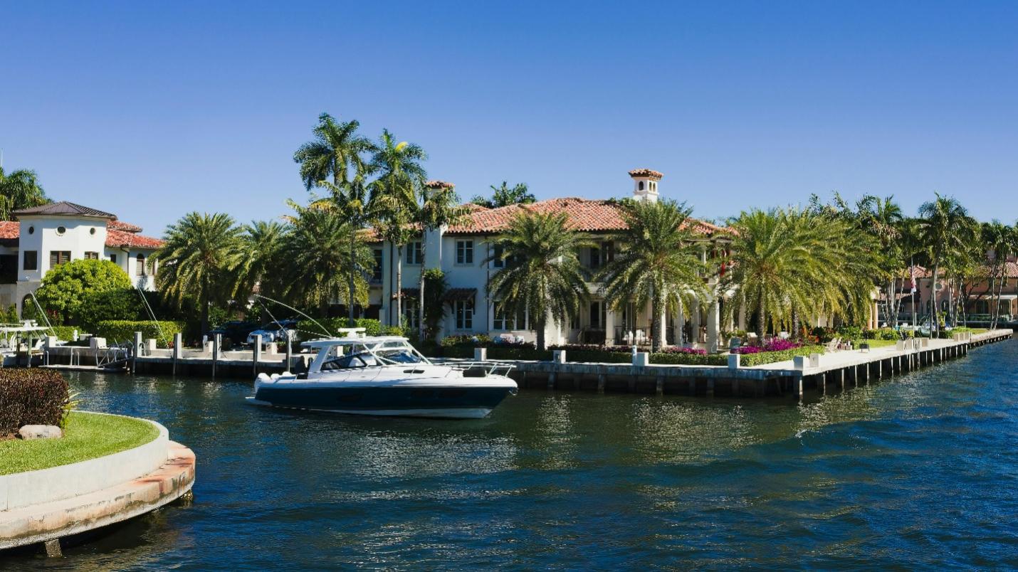 A white boat docked in Florida