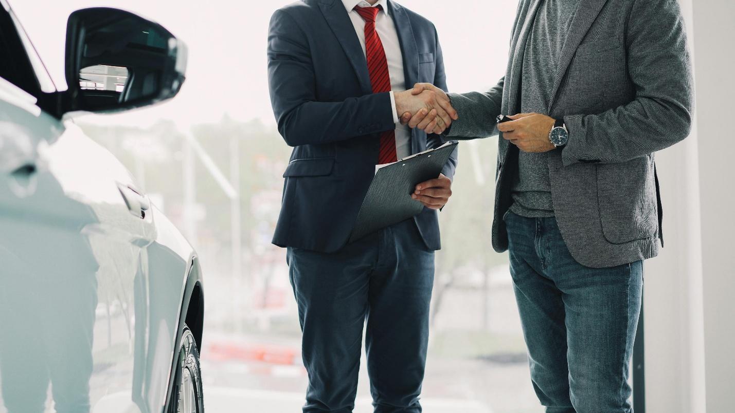 An agent shaking hands with a client