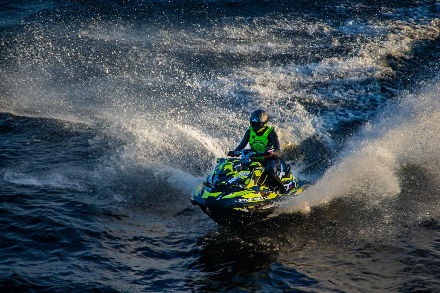 A person riding a jet ski on the sea