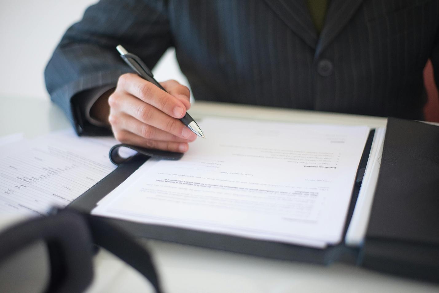 A person signing a document