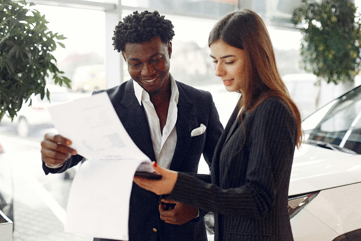 An agent showing a document to a customer